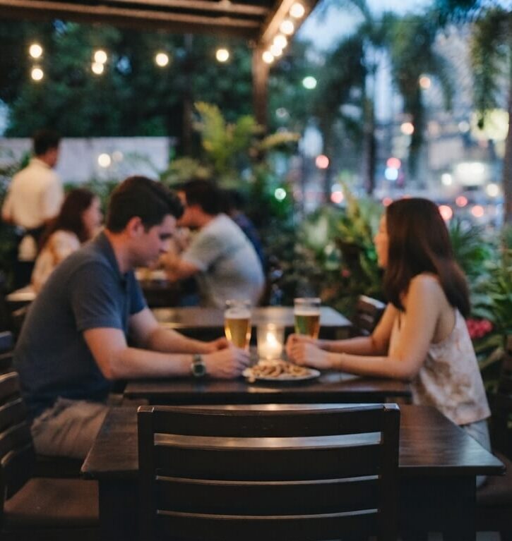 A young man and woman having casual drinks at a restaurant in Davao City.
